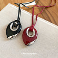 Black Cord Necklace With Layered Teardrop Pendant in Red and Black view 3