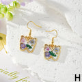 Gold Tone Pressed Flower Butterfly Drop Earrings in Twelve Designs view 11