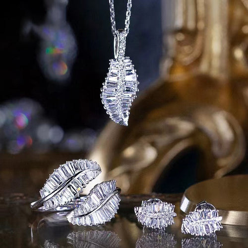 Leaf pendant necklace open ring and stud earrings group display