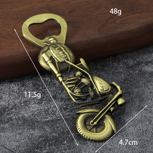 Antique bronze motorcycle opener with printed dimension and weight labels.