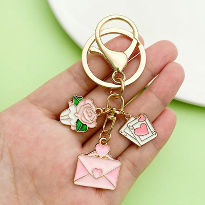 Image 1 showing a person holding up some charms.