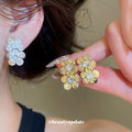 Faceted Crystal Flower Stud Earrings in Gold and Silver Tones view 1