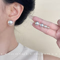 White Pearlescent Round Stud Earrings In Five Graduated Sizes view 2