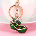Red and Green Enamel Peanut Keychains with Floral Accents view 1
