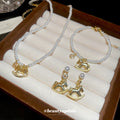 Pearl Necklace Bracelet Earrings Gold Rocking Horse Charms view 1