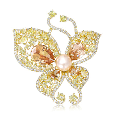Gold yellow champagne pearl butterfly brooch front on white