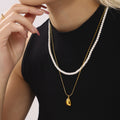 Gold Steel Teardrop Pendant Necklaces and White Shell Pearl Strand view 4