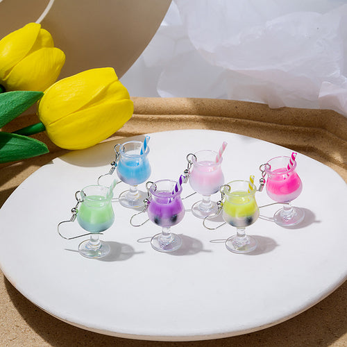 Six color miniature cocktail glass straw drop earrings on white plate