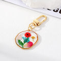 Gold Tone Pressed Flower Resin Clip Keychains in Eight Round and Irregular Designs view 4
