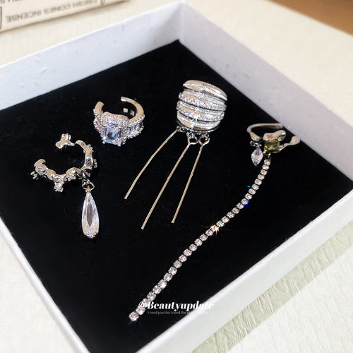 Close display of the silver crystal ear cuff drop earrings fashion jewelry accessory