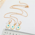 Gold Tone Oval Pearl Blue Evil Eye Pendant Necklace and Earrings view 4