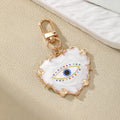 Gold Tone White Heart and Round Evil Eye Clip Keychains view 6