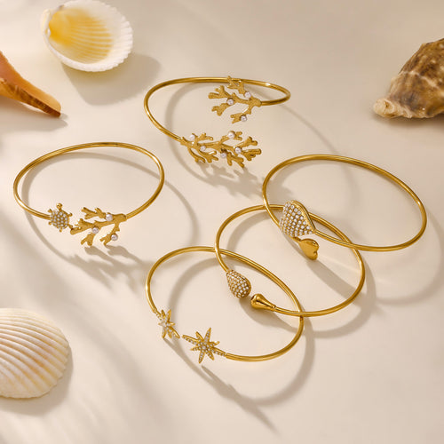 Five gold open bangles star teardrop heart coral with seashells