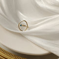 Gold Open Geometric Oval Ring With Tiny Teal Stone view 4