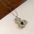 Silver Gourd Pendant Necklace Green Center Crystal Halo view 1