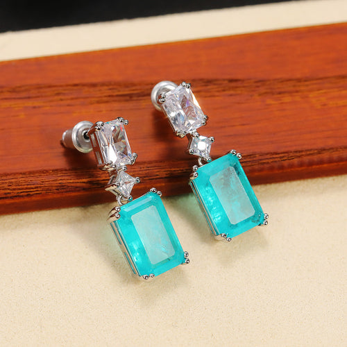 Second product view showing silver-tone aqua rectangular two-stone long drop earrings