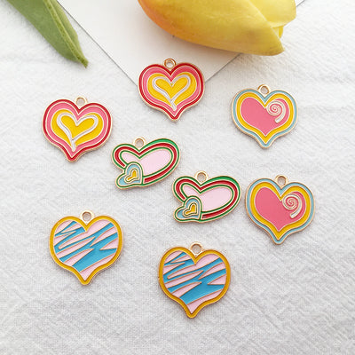 Colorful heart charms arranged on a light background