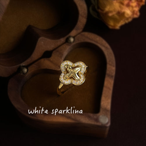 Gold clover knot pavé ring in heart-shaped wooden box