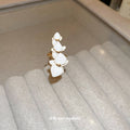 White Orchid Ear Cuff with Gold Tone Floral Details view 2
