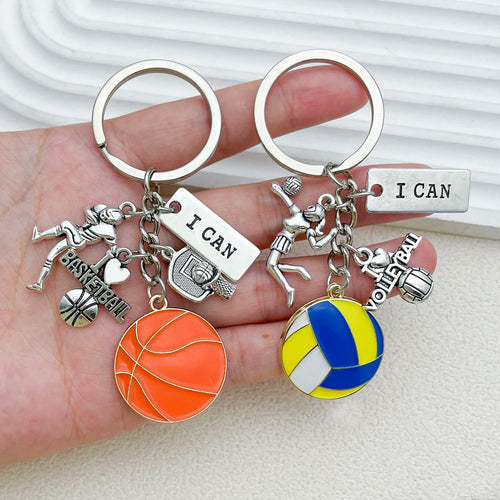 Image 2 showing a hand holding several different key chains.