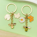 Bee and Honeycomb Charm Keychains Featuring Butterfly Across 47 Pictured Variations view 4