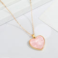 Gold Tone Pearlescent Heart Pendant Necklaces in Pink and Purple view 2
