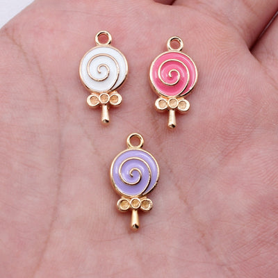 White Lollipop, Pink Lollipop, Purple Lollipop swirl lollipop enamel charms in image 1, shown from the front