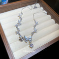Silver Tone Butterfly Necklace with Blue Crystal Accents view 2