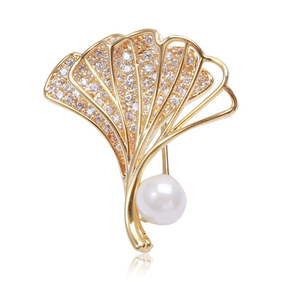 Gold Tone Ginkgo Leaf Brooch shown alone on a light background