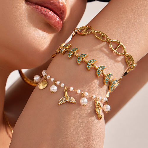 On-wrist view of marine charm bracelet collection in main image 2.