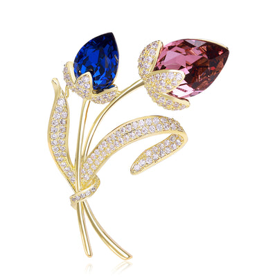 Blue and pink crystal twin tulip brooch on white ground