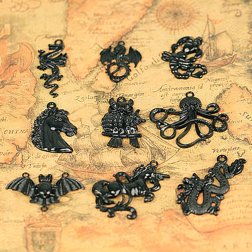 Ten glossy black animal and fantasy-creature charm designs shown in main image 1