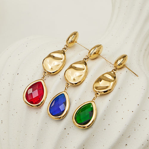 Blue green and red teardrop glass gold drop earrings flat lay