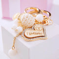 Wooden Love Heart Rabbit Fur Pom Keychains in Fifteen Pictured Fur Colors view 6