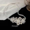 White Beaded Flower Collar Necklace With Polished Metal Tone Details view 2