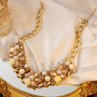 Champagne flower pearl necklace on white silk