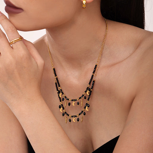 Layered double black crystal moon tassel necklace side profile