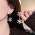 Silver Crystal Snowflake Drop Earrings with Double Starbursts view 2