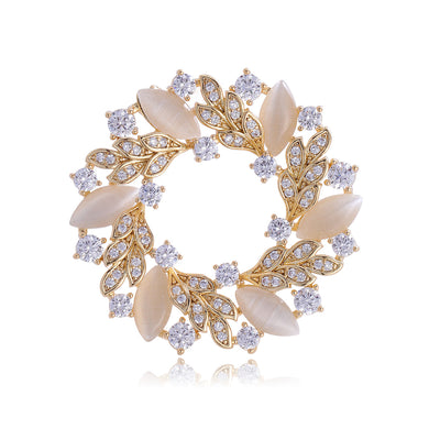 Front product view of the flower brooch pin in gold and silver