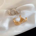 Crossed Triple Hoop Earrings in Gold and Silver Tone view 3