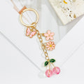 Gold Heart Clasp Charm Keychain With Bow Cherry Accent view 8