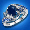 White Gold Star Motif Ring Blue Oval Cabochon Sizes 6-10 view 1