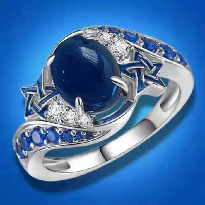 White Gold Star Motif Ring Blue Oval Cabochon Sizes 6-10