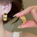 Twisted C Hoop Earrings in Mixed Gold and Silver Tones view 4