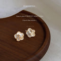White Camellia Flower Stud Earrings Gold Rim Clear Center view 1