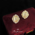 Gold Tone Cream Oval Stone Clear Halo Stud Earrings For Women view 3
