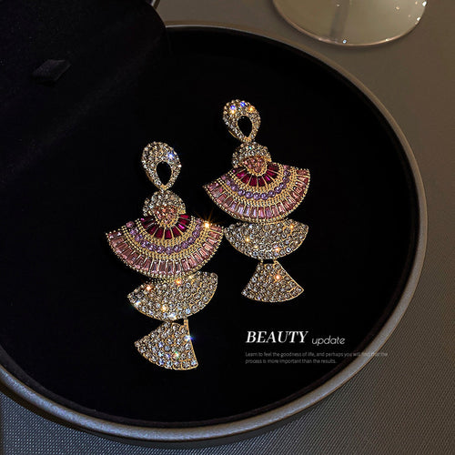 Gold Pink Tiered Fan Crystal Dangle Statement earrings in a on-ear view