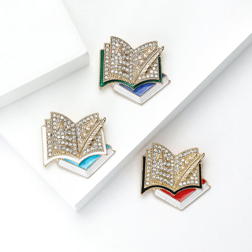 Three book brooches aqua blue green and red black colorways