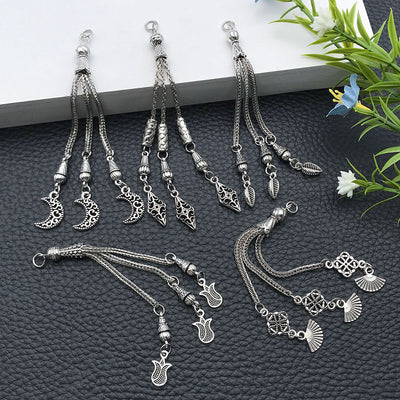 Silver-tone connector jewelry findings arranged on a light background