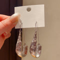 Long Faceted Resin Teardrop Earrings in Gold and Silver Tones view 6